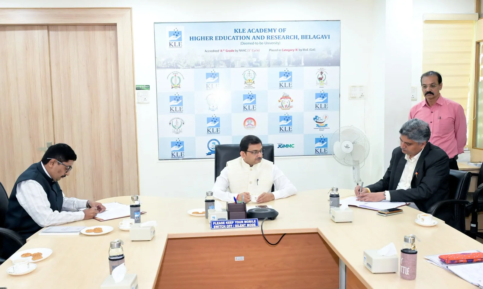 MoU documents being signed at the meeting table